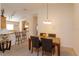 Bright dining area with seating for four and kitchen access at 2005 Royal Ridge Dr, Davenport, FL 33896