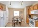 Bright kitchen nook with glass table and chairs at 2005 Royal Ridge Dr, Davenport, FL 33896