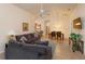 Open concept living room with views of the kitchen and dining area at 2005 Royal Ridge Dr, Davenport, FL 33896