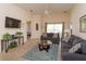 Spacious living area with a sectional sofa and access to the backyard at 2005 Royal Ridge Dr, Davenport, FL 33896