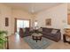 Bright living room features a comfortable sectional sofa and a large TV at 2005 Royal Ridge Dr, Davenport, FL 33896