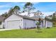Charming single-Gathering home featuring a two-car garage, well-manicured lawn, and welcoming curb appeal at 14927 Sw 25Th Cir, Ocala, FL 34473