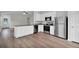 Open concept kitchen with granite countertops, stainless steel appliances, and seamless access to the living area at 14927 Sw 25Th Cir, Ocala, FL 34473