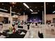 Large event space features a performance stage, tables with elegant black and white decor, and a spacious dance floor at 4331 Valencia Dr, Indian Lake Estates, FL 33855