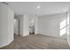 Well-lit room features plush carpet, white walls, and modern fixtures, offering a blank canvas for personalization at 4711 Sw 136Th Pl, Ocala, FL 34473