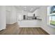 Bright kitchen with eat-in counter, stainless steel appliances, and modern cabinetry at 4711 Sw 136Th Pl, Ocala, FL 34473
