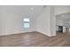 Sunlit room showcasing floors, white walls, and an open floorplan at 4711 Sw 136Th Pl, Ocala, FL 34473