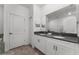 Bathroom with double vanity, stone countertop, and modern faucets at 2901 Protagonist St, Kissimmee, FL 34746