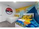 Themed bedroom with two twin beds, custom decor, and carpeted floors at 2901 Protagonist St, Kissimmee, FL 34746