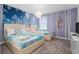 Themed bedroom with two twin beds, and a custom painted wall at 2901 Protagonist St, Kissimmee, FL 34746