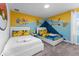 Bedroom featuring two beds, a custom Pokemon themed mural wall, and soft lighting fixtures at 2901 Protagonist St, Kissimmee, FL 34746