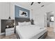 Comfortable bedroom featuring a queen bed, modern decor, and soft lighting fixtures at 2901 Protagonist St, Kissimmee, FL 34746