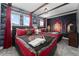 Themed bedroom with two beds, custom decor, and wooden ceiling beams at 2901 Protagonist St, Kissimmee, FL 34746