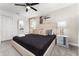 Comfortable bedroom featuring a queen bed, modern decor, and soft lighting fixtures at 2901 Protagonist St, Kissimmee, FL 34746
