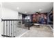 Upstairs game room with comfortable seating and a custom superhero themed mural wall at 2901 Protagonist St, Kissimmee, FL 34746