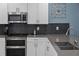 This kitchen features subway tile, quartz countertops, stainless steel appliances, and custom cabinets at 2901 Protagonist St, Kissimmee, FL 34746