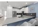 This kitchen features a stainless steel refrigerator, quartz countertops, and white cabinets at 2901 Protagonist St, Kissimmee, FL 34746