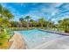Beautiful lazy river with palm trees, lounge chairs and shallow water fountains, perfect for families at 2901 Protagonist St, Kissimmee, FL 34746