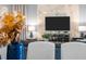 The living room is decorated with a marble accent wall, modern furniture, and a large television at 2901 Protagonist St, Kissimmee, FL 34746