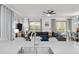 The living room features a sink, quartz counters, modern decor, and natural light from the sliding glass door at 2901 Protagonist St, Kissimmee, FL 34746