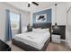 Modern main bedroom with carpet floors, minimalist decor, and natural light from the window at 2901 Protagonist St, Kissimmee, FL 34746