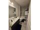 Stylish bathroom featuring a sleek vanity and a tiled shower-tub combination with modern fixtures and finishes at 2659 Park Ridge St, Apopka, FL 32712