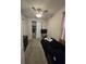 Simple bedroom with neutral tones, including a ceiling fan and closet, offers a cozy and functional living space at 2659 Park Ridge St, Apopka, FL 32712