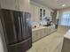 Spacious kitchen equipped with stainless steel appliances, white countertops, and ample cabinet space for cooking and storage at 2659 Park Ridge St, Apopka, FL 32712
