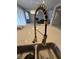 A modern kitchen sink is equipped with a gooseneck faucet on the kitchen island, blending style and functionality at 2659 Park Ridge St, Apopka, FL 32712