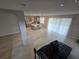 View of kitchen and living room featuring open concept and tile flooring at 2659 Park Ridge St, Apopka, FL 32712