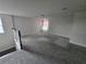 Spacious carpeted loft area with window, ideal for relaxation or entertainment at 2659 Park Ridge St, Apopka, FL 32712