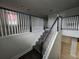 View of staircase and landing featuring dark wood steps and white banister at 2659 Park Ridge St, Apopka, FL 32712