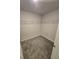 Carpeted walk-in closet with wire shelving for organized storage at 2659 Park Ridge St, Apopka, FL 32712