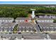 Community aerial view showcasing townhomes, landscaping, and trail access with scenic water views at 432 Diamond Dove Cv, Winter Springs, FL 32708