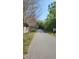 Scenic view of a paved community path lined with trees and greenery at 432 Diamond Dove Cv, Winter Springs, FL 32708