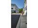 Exterior shot of neighborhood street highlighting garages and lush landscaping at 432 Diamond Dove Cv, Winter Springs, FL 32708