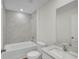 Modern bathroom featuring a tub shower, white vanity, and sleek fixtures at 2722 Sw 151St Pl, Ocala, FL 34473