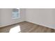 Well-lit bedroom with beautiful wood floors and a bright, airy feel at 2722 Sw 151St Pl, Ocala, FL 34473