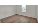 Cozy bedroom with wood flooring, a bright window, and neutral walls for a serene atmosphere at 2722 Sw 151St Pl, Ocala, FL 34473