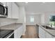 Bright kitchen featuring granite countertops, stainless steel appliances, and an open design at 2722 Sw 151St Pl, Ocala, FL 34473
