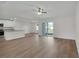 Bright, open-concept living space featuring wood floors and seamless access to the outdoor patio at 2722 Sw 151St Pl, Ocala, FL 34473