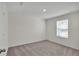 Bright bedroom with soft carpet, fresh paint, and natural light from the window at 2645 Sw 163Rd Pl, Ocala, FL 34473