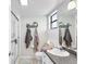 Clean bathroom with a shower, toilet and granite countertop at 565 Lake Mystic Ln, Lakeland, FL 33813