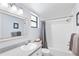 Bathroom with tub, shower, and updated vanity at 565 Lake Mystic Ln, Lakeland, FL 33813