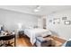 Bright bedroom with a double bed, desk, and wood floors at 565 Lake Mystic Ln, Lakeland, FL 33813