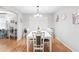 Bright dining room with white table and six chairs at 565 Lake Mystic Ln, Lakeland, FL 33813