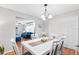 Dining room with white table, six chairs, view to living room at 565 Lake Mystic Ln, Lakeland, FL 33813