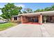 Carport and side yard of brick home at 565 Lake Mystic Ln, Lakeland, FL 33813