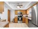 Kitchen with stainless steel appliances and wood cabinets at 565 Lake Mystic Ln, Lakeland, FL 33813