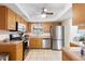 Kitchen with stainless steel appliances and wood cabinets at 565 Lake Mystic Ln, Lakeland, FL 33813